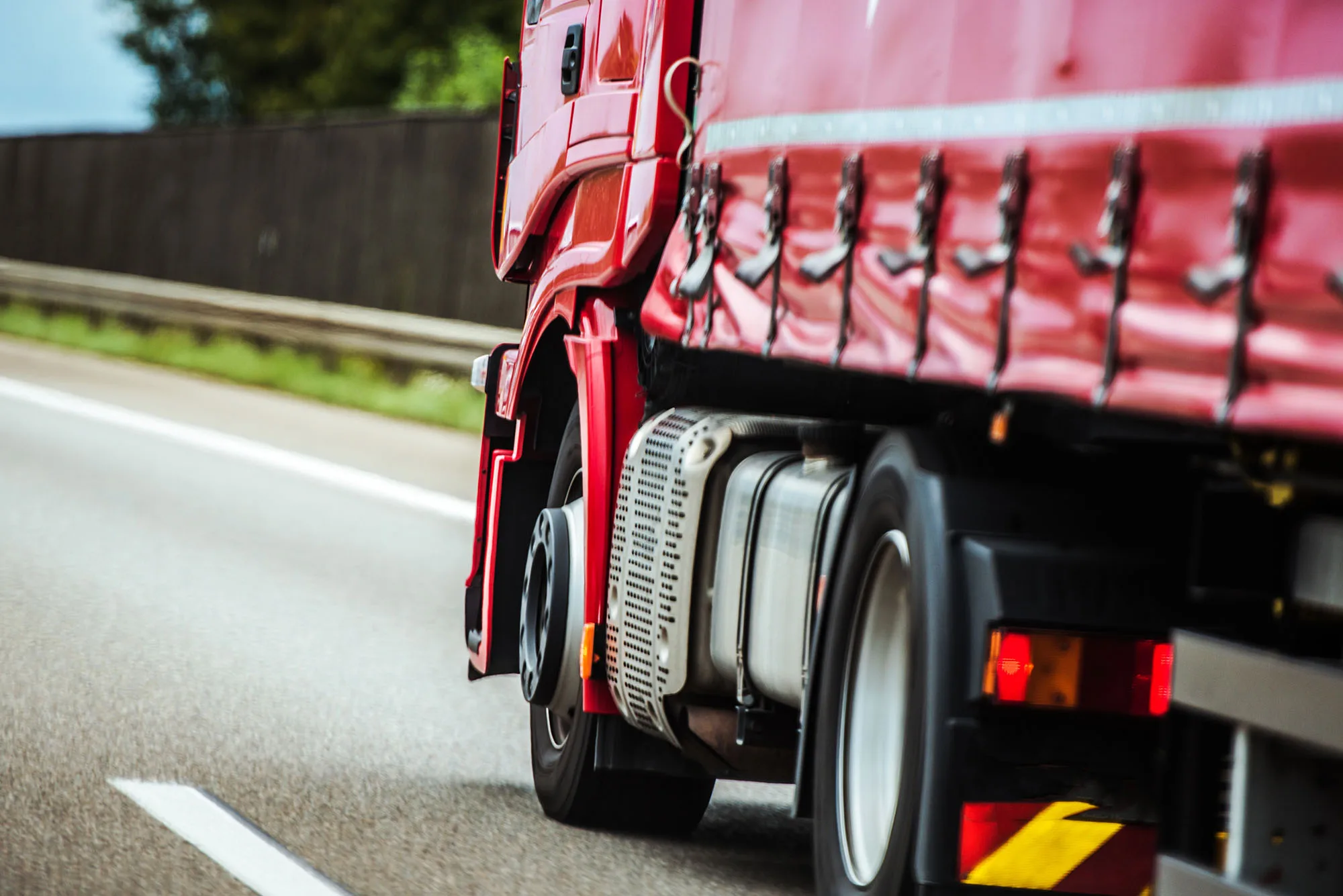 Red freight truck on the road